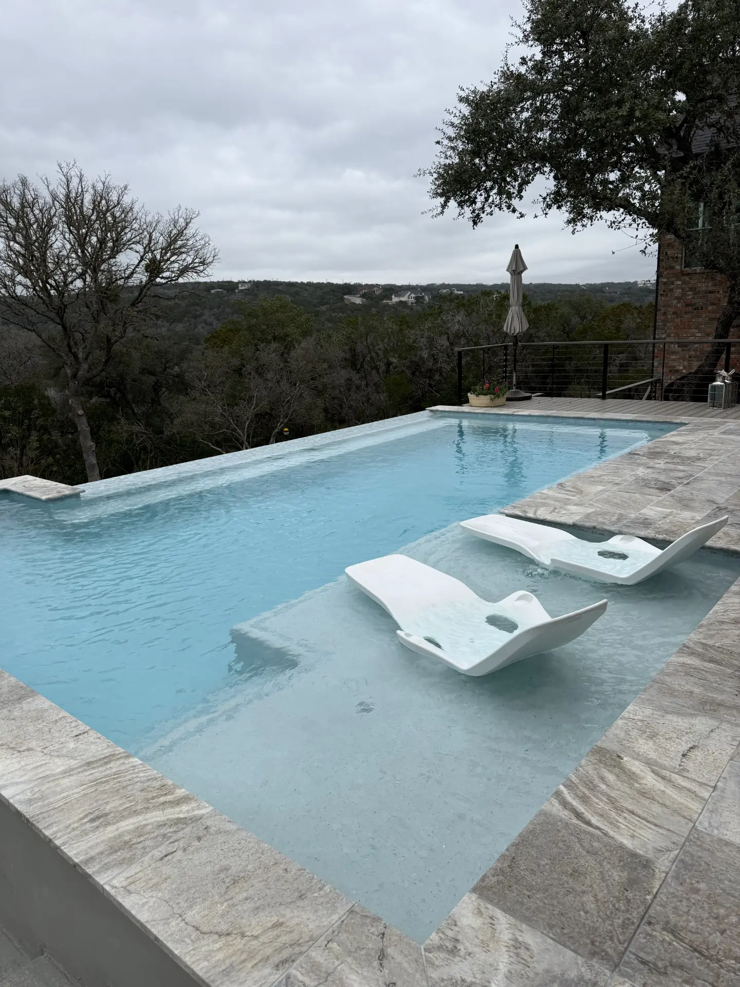 Hill Country pool with in-water loungers
