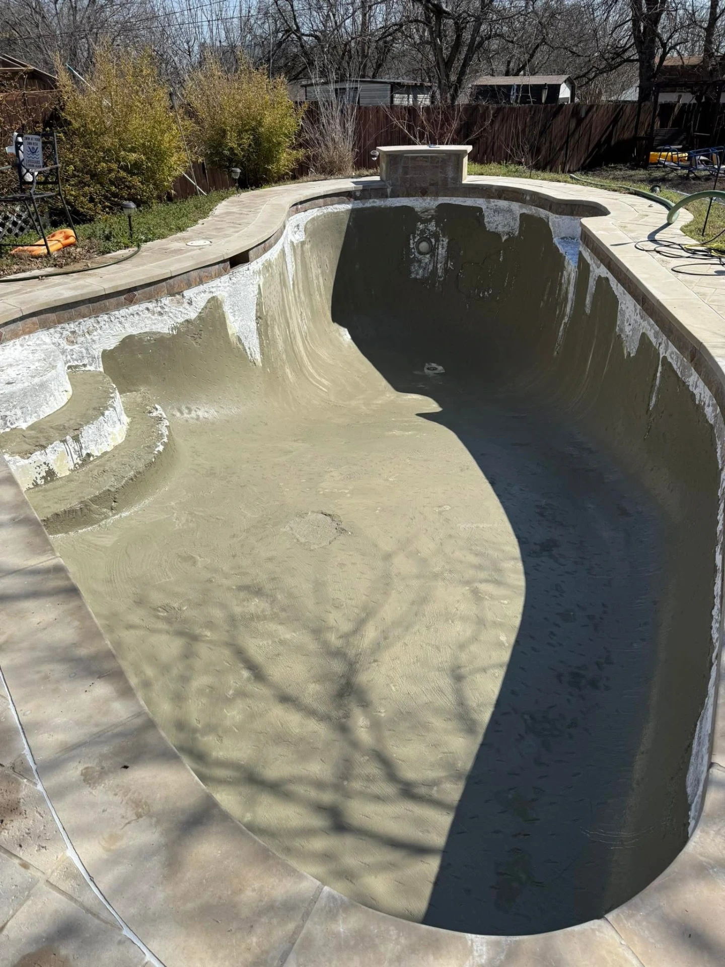 Drained pool shell prepped and chipped out for new plaster